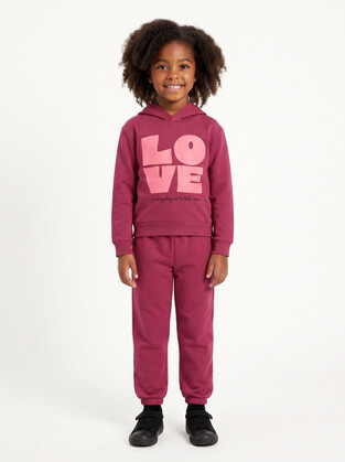 TRAX jumpsuit set with hood in fuchsia color.