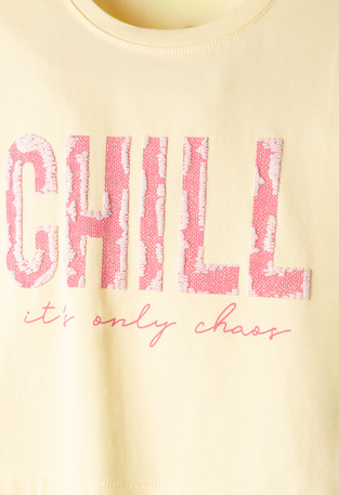 Κοντή μπλούζα ΕΒΙΤΑ σε χρώμα κίτρινο.