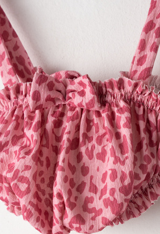 EVITA shorts set in fuchsia color with animal print.