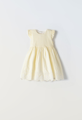 EBITA dress in yellow color with check pattern.