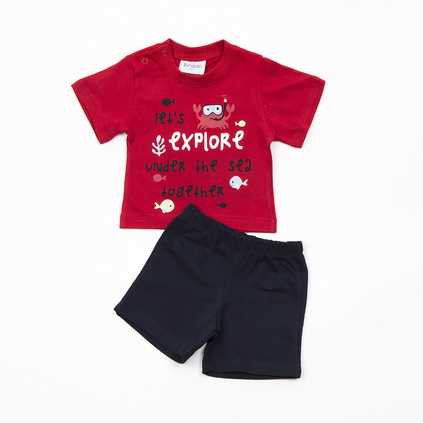 TRAX shorts set in red with "let's explore" print.