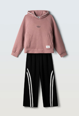 EVITA jumpsuit set in dark pink with black.