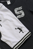 SPRINT shorts set in black with embossed basketball player print.