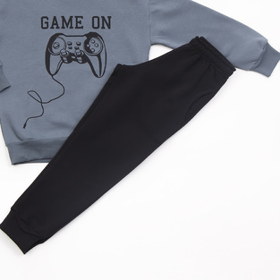 Gray TRAX tracksuit set with embossed "GAME ON" logo.