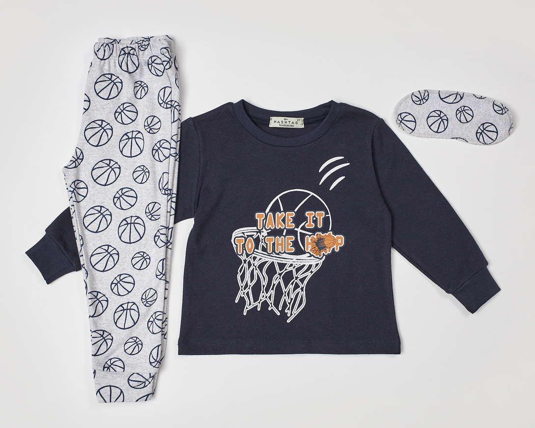 HOMMIES pajama in dark blue with embossed basketball print and matching sleep mask.