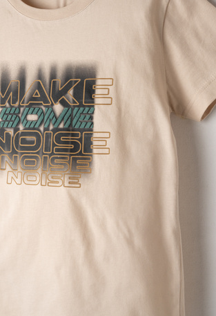 HASHTAG blouse in beige with print on the front.