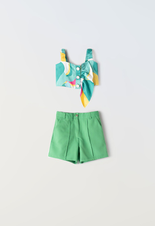 EBITA shorts set in green color with all over print.