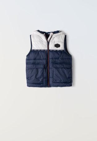 HASHTAG sleeveless jacket in blue color with hood.