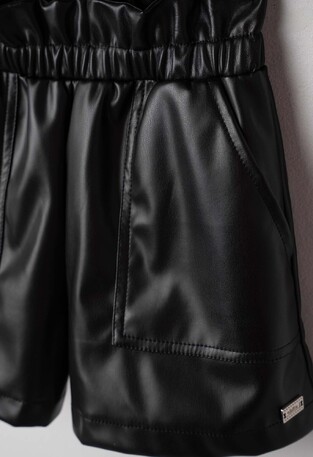EVITA shorts set in white-black with leather texture.
