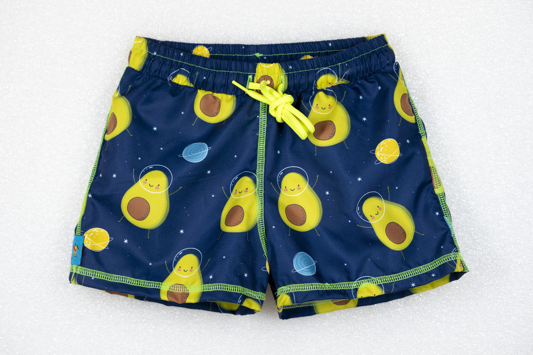 TORTUE bermuda swimsuit with avocado print in space.