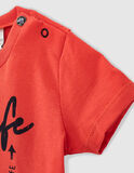 IKKS blouse in orange color with trunks on the side.