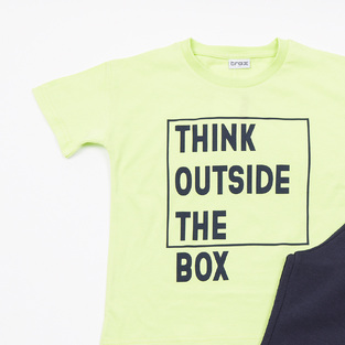 Σετ σορτς TRAX σε λάιμ με μαύρο χρώμα και τύπωμα στο μπροστινό μέρος.