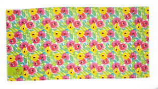 Beach towel TORTUE 140 X 70 cm. with all over colorful floral print.