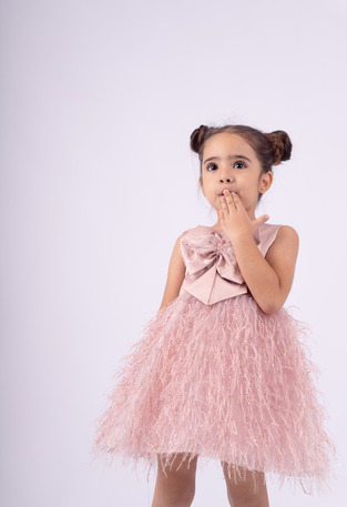 EBITA dress in soft pink color with an impressive bow on the chest.