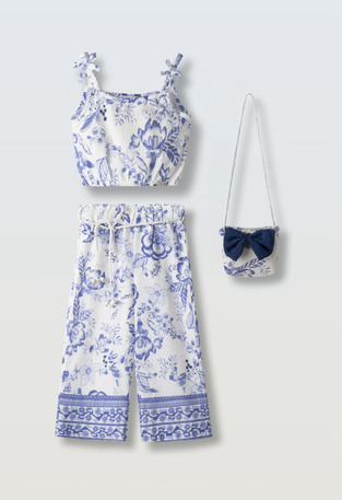 Σετ παντελόνα ΕΒΙΤΑ σε λευκό χρώμα με floral print και ασορτί τσαντάκι.