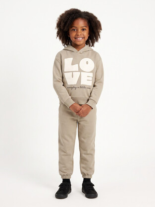 TRAX jumpsuit set with hood in beige color.