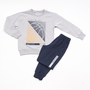 Seasonal TRAX tracksuit set in gray with "JUST PLAY" logo.