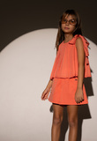 EBITA shorts set in peach color with pleated fabric.